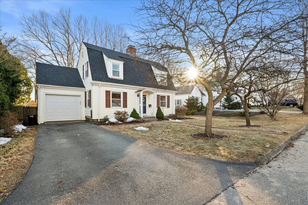 Charming Cape With Modern Updates & Spacious Backyard